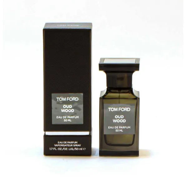 Tom Ford Oud Wood Eau de Parfum Spray in luxurious dark bottle with exotic woody fragrance.