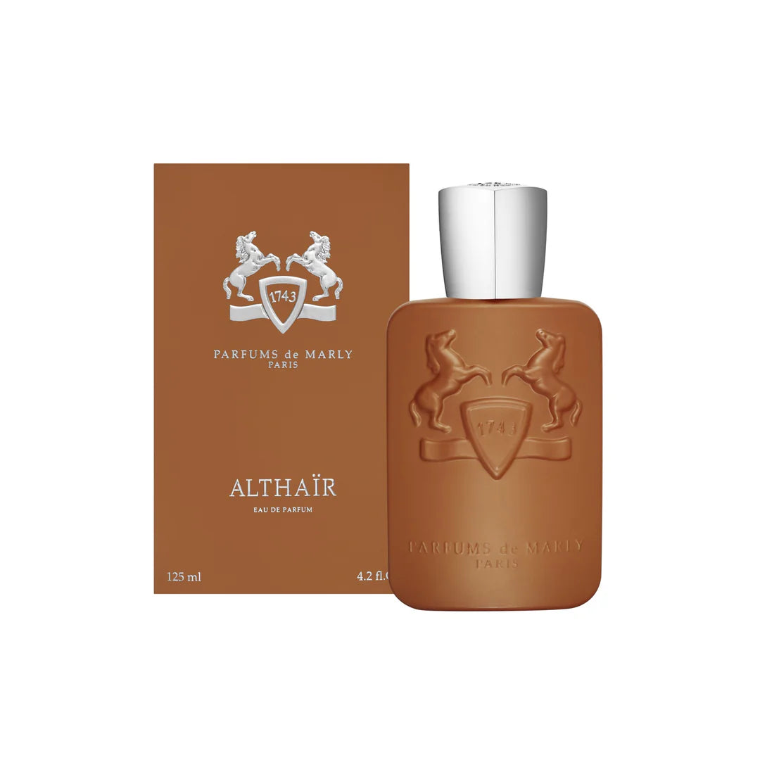 Luxury perfume bottle with artistic abstract design and minimalist white backdrop.