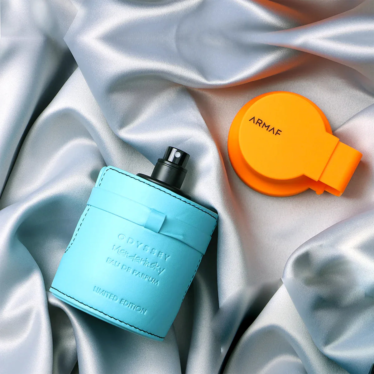Armaf Odyssey Mandarin Sky EDP – Limited edition bottle on blue satin with orange cap.