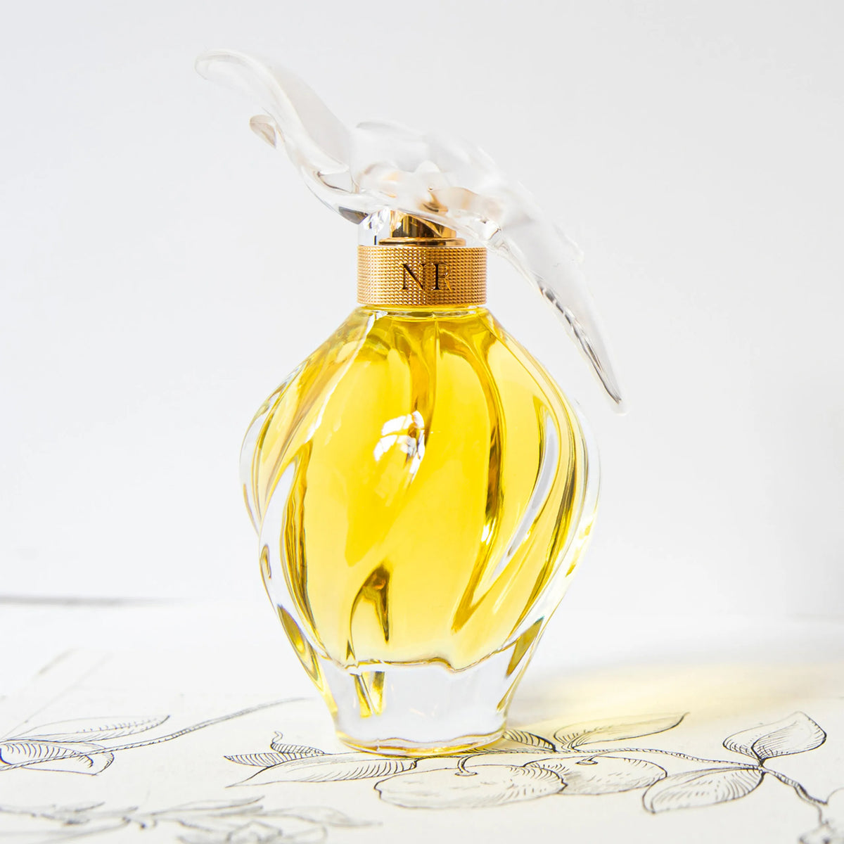 L'Air du Temps by Nina Ricci, a classic spicy-floral fragrance with jasmine, rose, and spices.