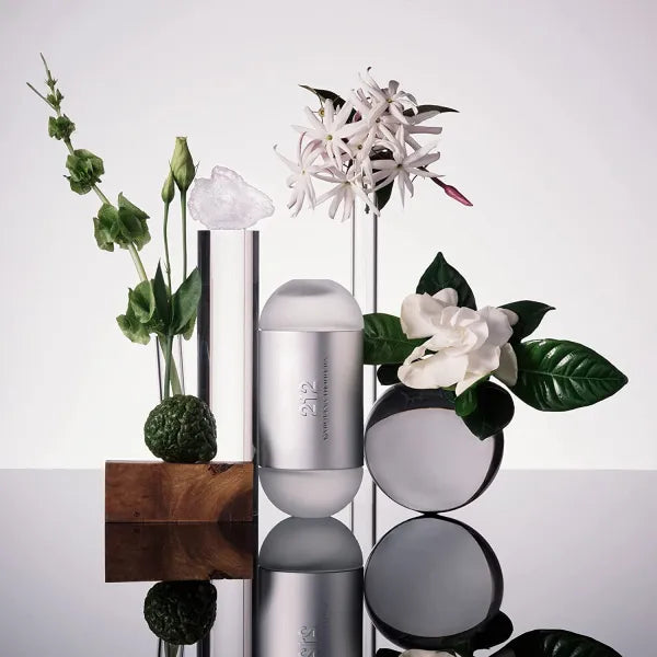 Carolina Herrera 212 Men EDT featuring modern cylindrical packaging with energetic scent.
