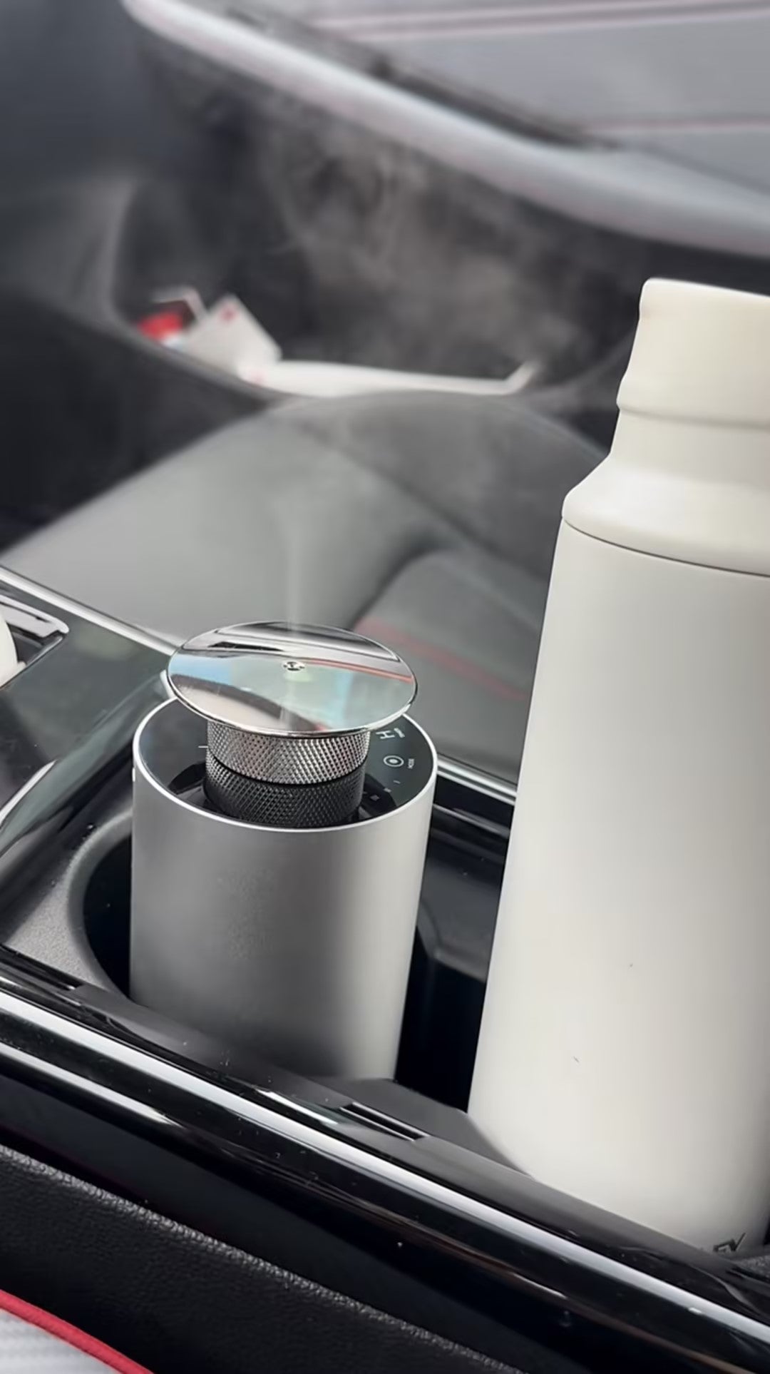 Smart rechargeable essential oil diffuser in sleek black design, ideal for home or office aromatherapy.
