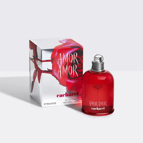 Cacharel Amor Amor perfume with deep red packaging, known for its passionate floral-fruity scent.
