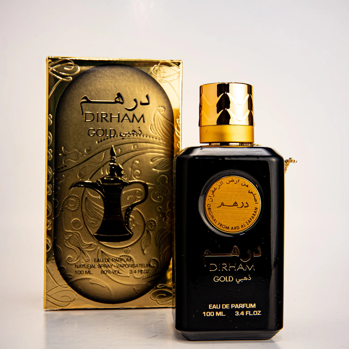 Dirham Gold perfume bottle - exotic and woody oriental fragrance.
