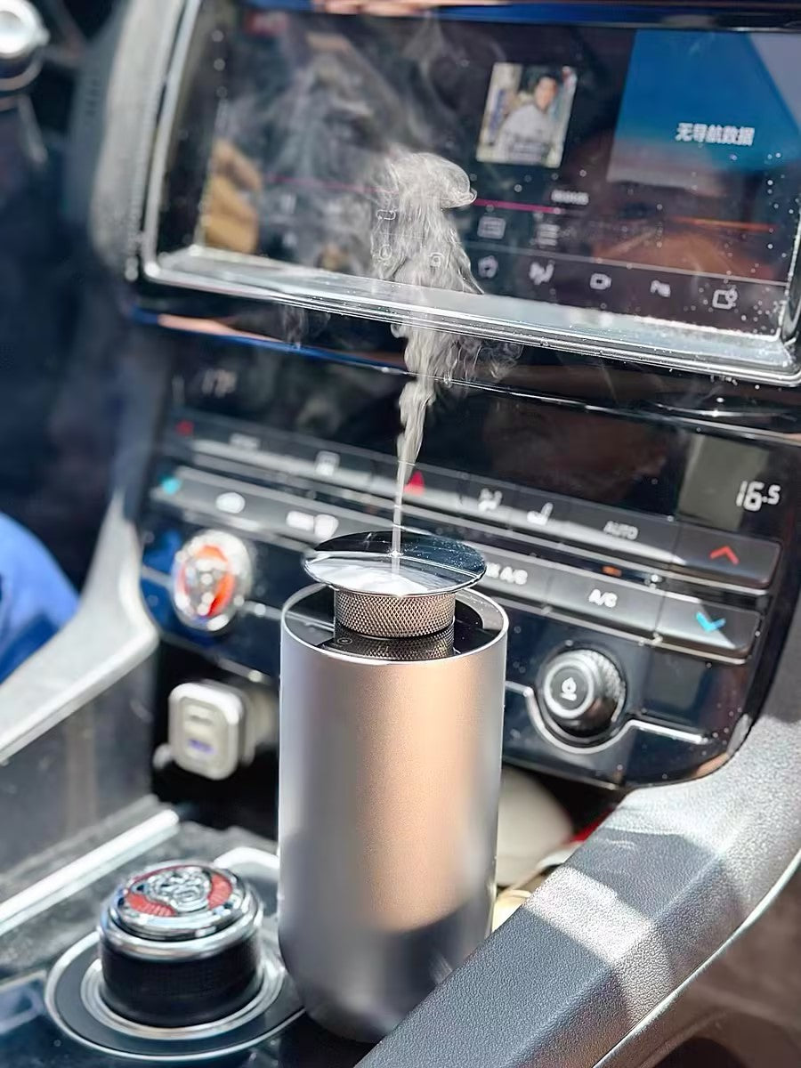Waterless car aroma diffuser with essential oils, USB rechargeable, portable, and smart auto features.
