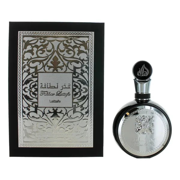 Fakhar Black EDP—warm, rich blend of amber, oud, spices & musk by Lattafa.

